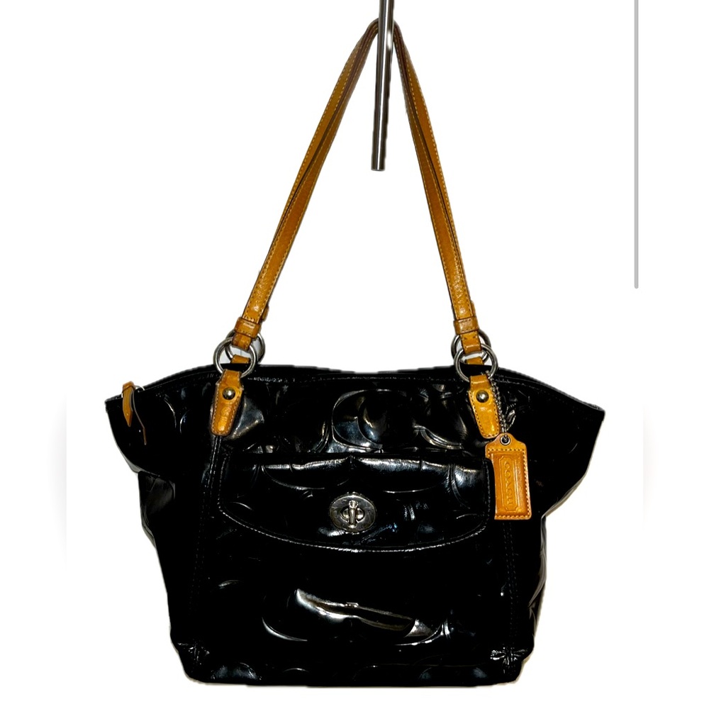 Coach patent leather tote bag with hang tag.